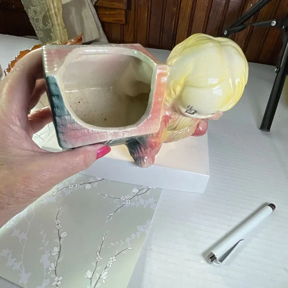 Vintage ceramic American Bisque Yarn Doll planter.